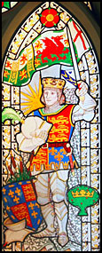 Stained Glass Window showing Henry VII with the standard of Cadwallader